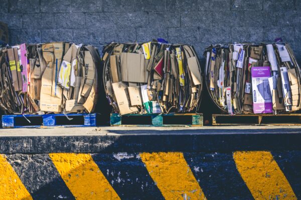 A row of three full recycling hoppers viewed from above